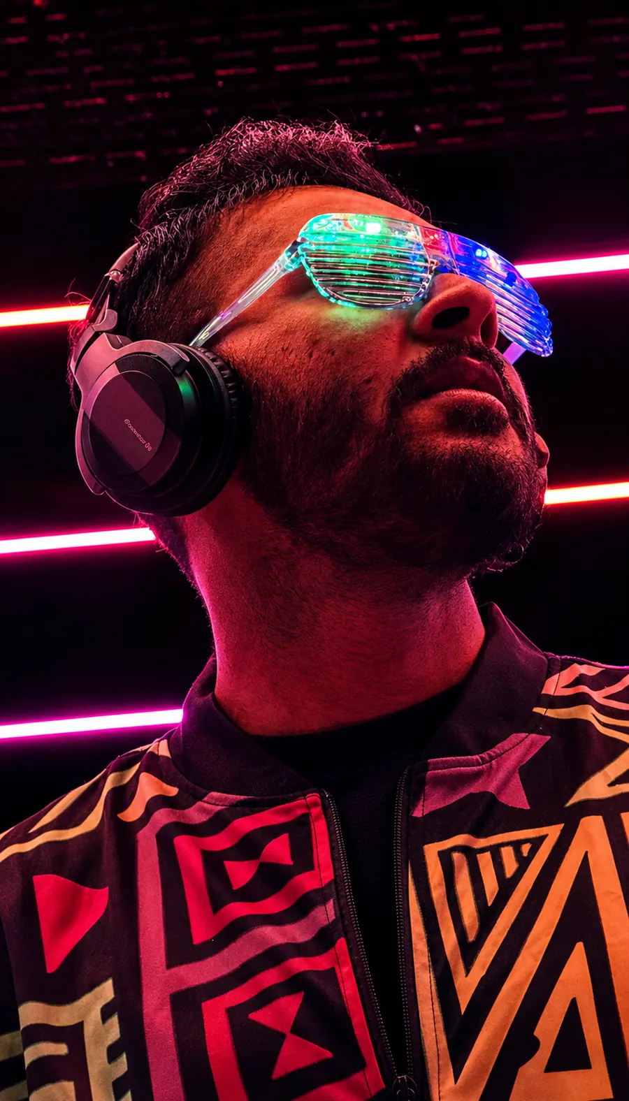 NIKJAY in illuminated glasses and headphones